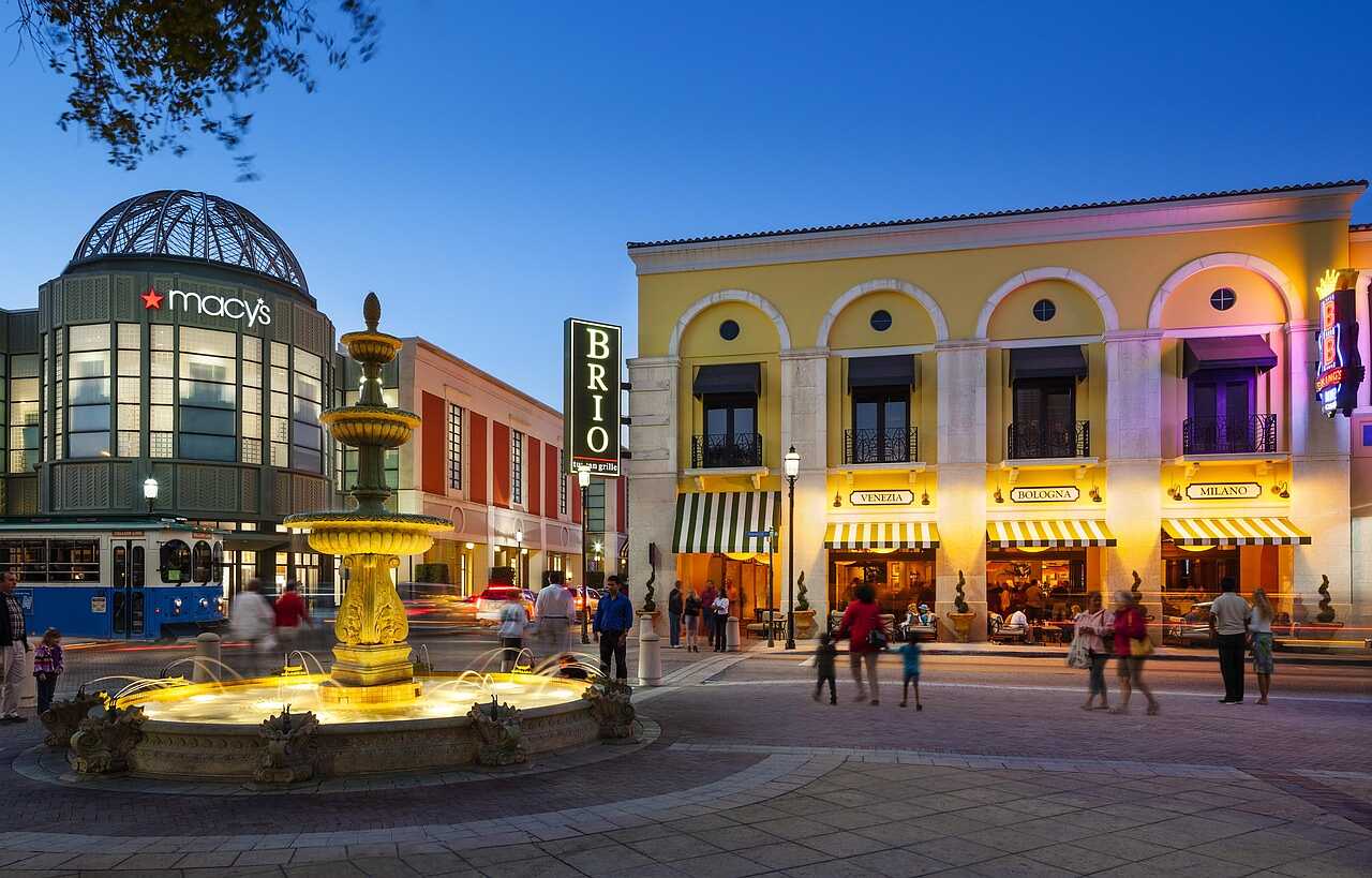 A downtown West Palm Beach plaza lit in the evening